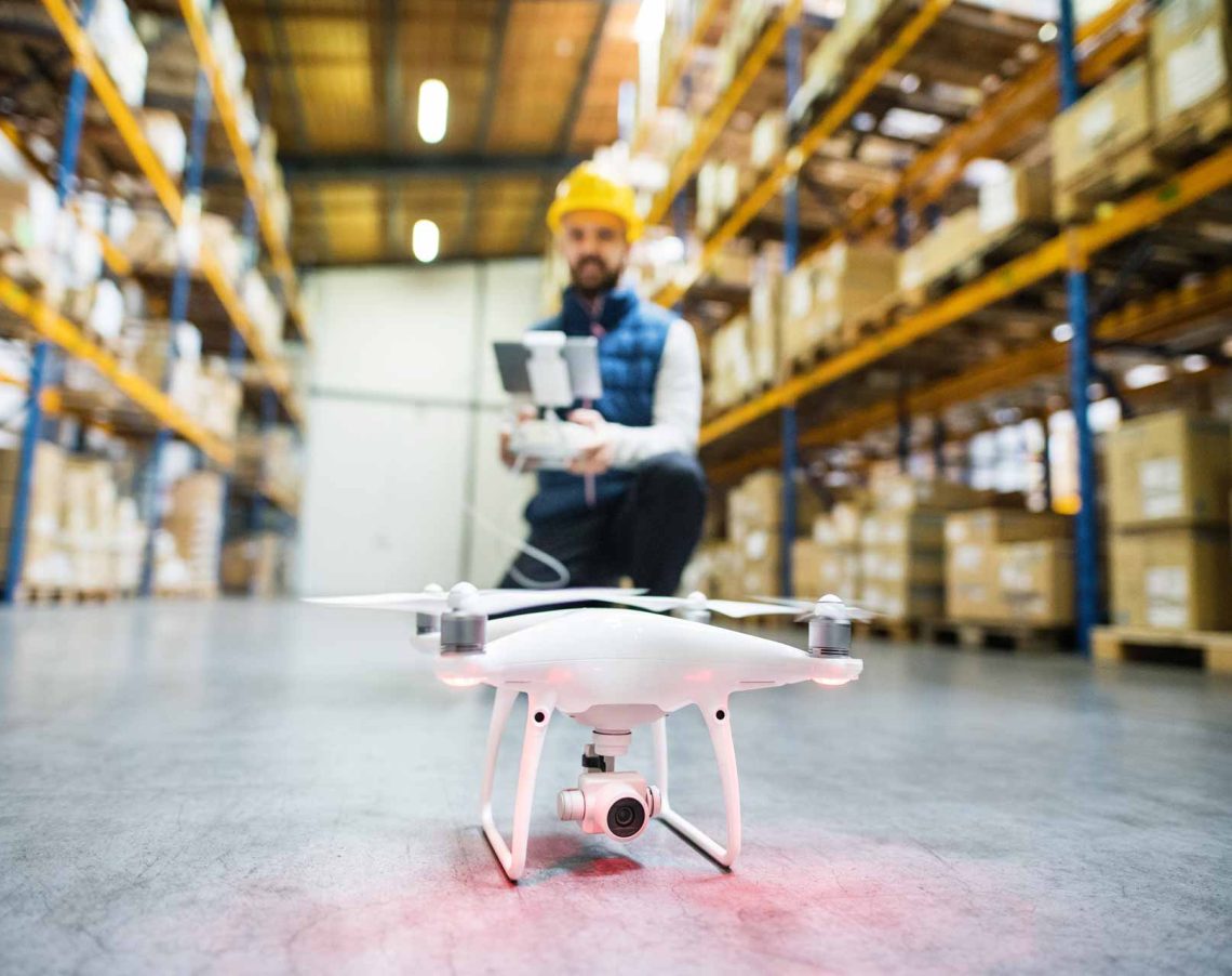 man-with-drone-in-a-warehouse-PMQEJ35-2.jpg