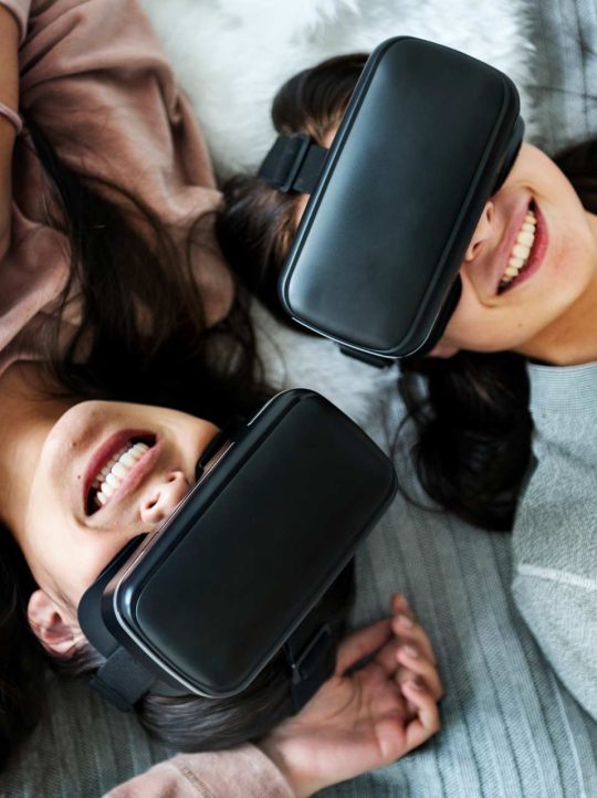 women-experiencing-virtual-reality-with-vr-headset-P8EWPYR-2.jpg